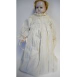 A French wax head doll: with fair mohair wig, blue paperweight eyes, on a cloth body with wax limbs,