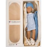 A Sasha 'Doll 'BSasha Blonde Gingham' No 107:, vinyl body with blonde hair and painted face,