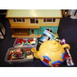 A 1960's dolls house: with hall and two ground floor rooms and three first floor rooms,