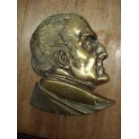 A 19th Century brass wall plaque of a bust of the Duke of Wellington:,