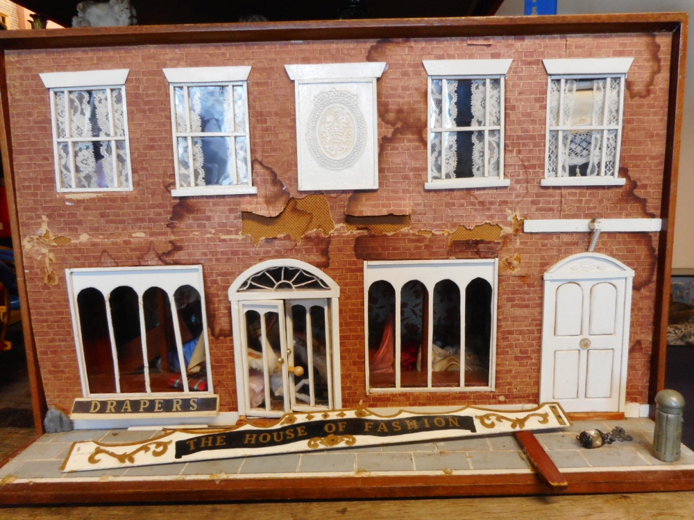 A draper/haberdashery's dolls shop: of rectangular outline with double-hinged back enclosing two