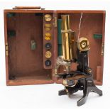 A lacquered brass microscope by J Swift & Son , London:,