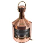 A copper and brass ship's Port lantern by G P Grimley & Sons, Birmingham:, the lens dated 1943,