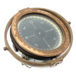 An 8 inch brass cased gyro compass:, in gimbal mount ,