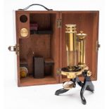 A lacquered brass monocular microscope by Stanley, London:,