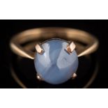 A star sapphire mounted single-stone ring: the star sapphire approximately 9.8mm long x 9.