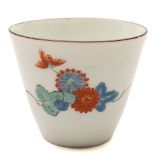 A Japanese 'Kakiemon' beaker: of tapered cylindrical form, painted in blue,