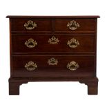 An early George III mahogany rectangular chest:, the top with a moulded edge,