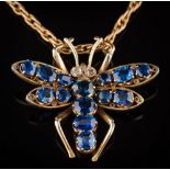 A sapphire mounted insect pendant: set with fourteen graduated oval and cushion-shaped sapphires