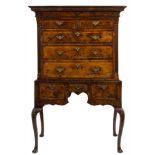 An early 18th Century walnut and inlaid chest on stand:, bordered with sycamore lines,