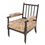 A Victorian ebonised and simulated rosewood bobbin turned armchair:,