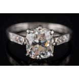 A diamond solitaire ring: the cushion-shaped old brilliant-cut diamond approximately 8.2mm long x 7.