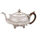 A George III silver teapot, maker's mark worn, London,