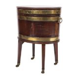 A George III mahogany, inlaid and brass bound oval wine cooler on stand,