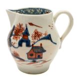 A Lowestoft sparrowbeak cream jug: with pear shaped body and loop handle,