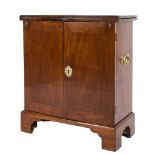 A bachelors mid 18th Century mahogany cabinet:, of rectangular shape with a hinged fold over top,