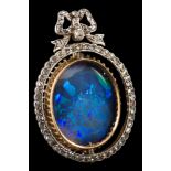 A homogenous black and white opal and diamond brooch: the oval opal stated to be approximately 21.