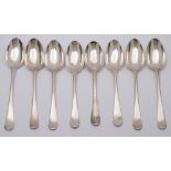 Eight Georgian silver Hanoverian pattern dessert spoons, marks worn,