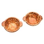 Two Hispano-Moresque copper lustre pottery bowls: with fringed leaf handles,