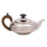 A George IV batchelor's silver teapot, maker's mark worn, London, 1824: crested,