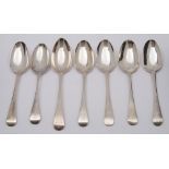 Seven Georgian silver Old English pattern tablespoons, various makers and dates: crested, 368gms.