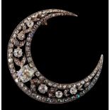 A 19th century diamond mounted crescent brooch: with graduated old brilliant-cut and rose-cut