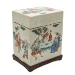 A Chinese famille rose porcelain oblong box and cover: painted overall with dignitaries and