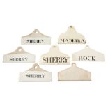 A group of seven English creamware bin labels: of 'coat hanger' form,