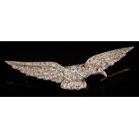 A rose diamond mounted eagle in flight brooch: pave-set throughout with rose diamonds and single