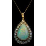 An opal and diamond pear-shaped pendant: the central pear-shaped opal approximately 22mm long x