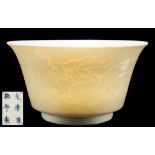 A Chinese anhua dragon bowl: with flared rim, the exterior carved with two dragons,