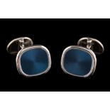 A pair of 'Patek Philippe' 18ct white gold 'Ellipse' cuff-links: the central polished blue plaques