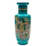 A Chinese famille verte turquoise ground rouleau vase: painted with dignitaries on a verandah with