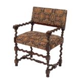 A carved walnut open armchair:, in the 17th Century taste, with machine tapestry seat and back,