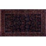 A Meshed rug:, the indigo field with palmette and floral foliate sprays,