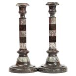 A pair of serpentine and marble candlesticks:,