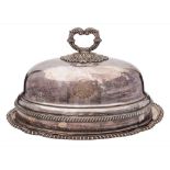 A silver plated meat dish and cover: crested, of oval outline with gadrooned borders, 42cm.