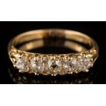 A graduated diamond five-stone ring: the round old,