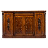 A Victorian mahogany low side cabinet:, the top with rounded corners and a reeded dentil edge,