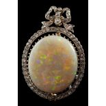 A homogenous black and white opal and diamond brooch: the oval opal stated to be approximately 21.