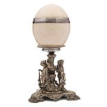 A 19th century ostrich egg table centre piece: the egg with silver girdle,