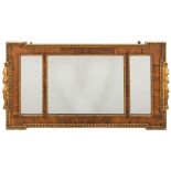 A walnut and partly gilt landscape wall mirror: of rectangular broken outline,