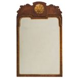 A 19th Century walnut and partly gilt wall mirror:, in the early 18th Century manner,