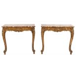 A pair of French carved giltwood rectangular console tables:,