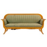 A Swedish birch settee in the Biedermeier style:, the upholstered back with curved top rail,