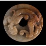 A Chinese 'chilong' jade disc, bi: in the Ming manner, carved with a single chilong,