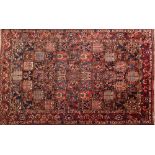 A Bakhtiar garden carpet:, the compartmented field with palmettes,