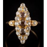 A Victorian cognac coloured diamond and diamond marquise-shaped cluster ring: with three round old,