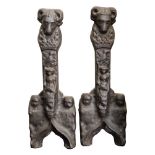 A pair of late 16th/early 17th Century cast iron andirons: with rams head terminals,