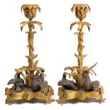 A pair of 19th century gilt metal candlesticks: with foliate decorated nozzles on naturalistic